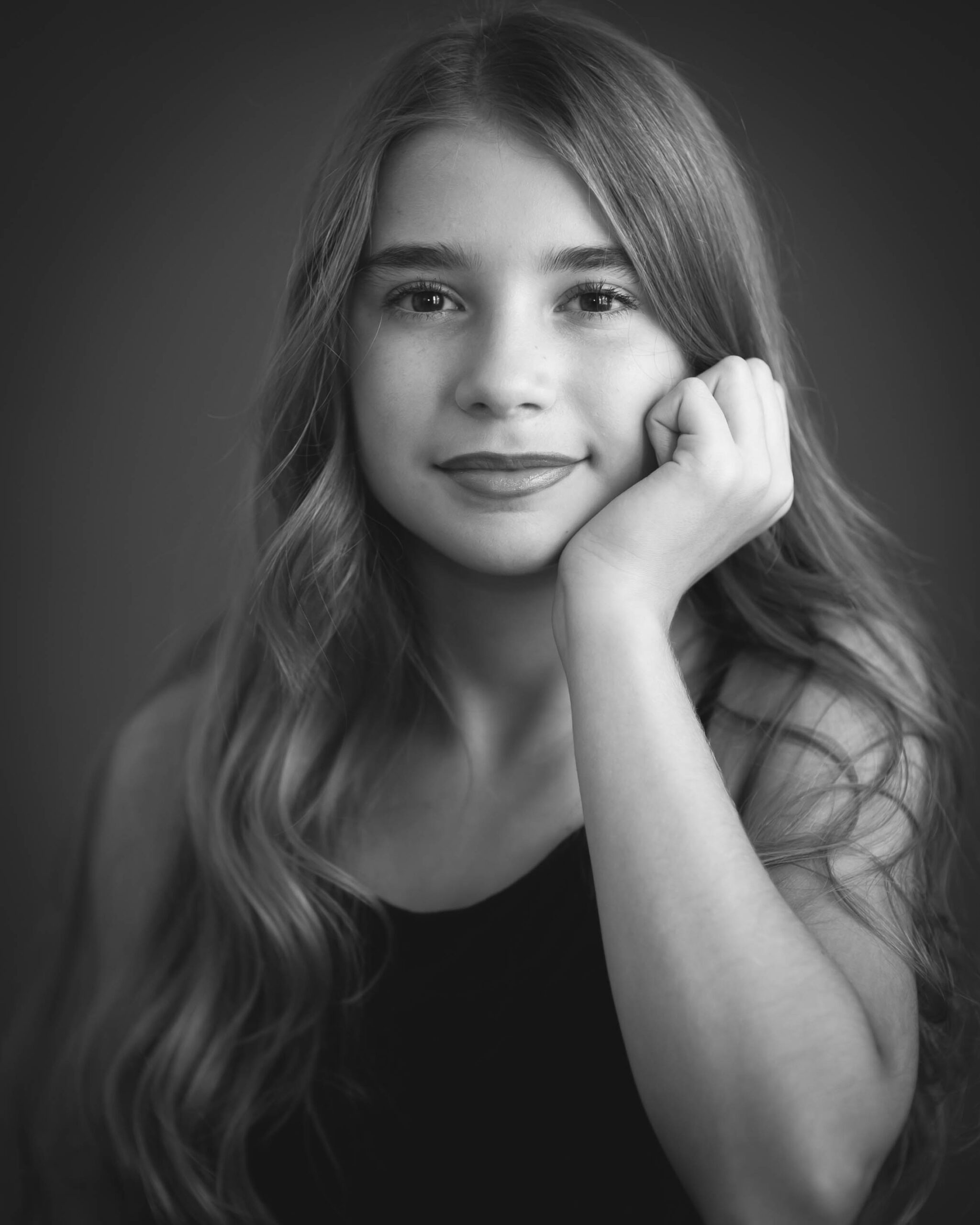 beautiful pre-teen girl in black and white studio portrait captured by Allison Amores Photography