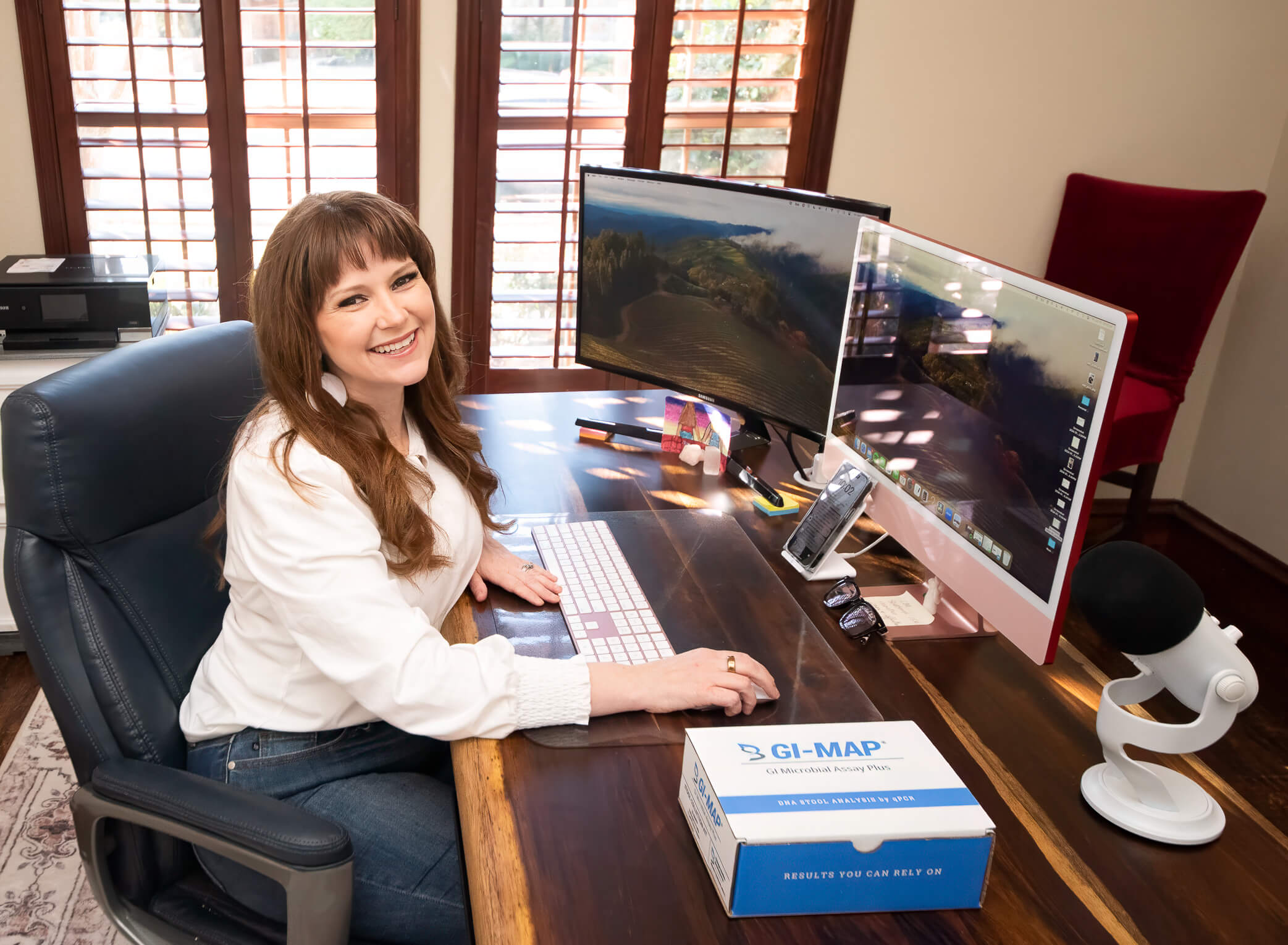 holistic hormone specialist working at desk in office