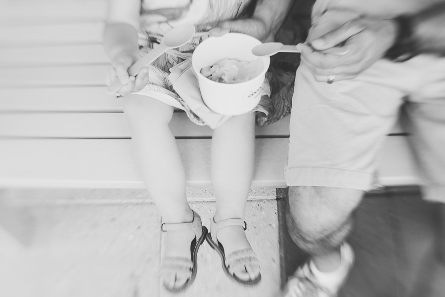little girl and dad having ice cream , black and white photo