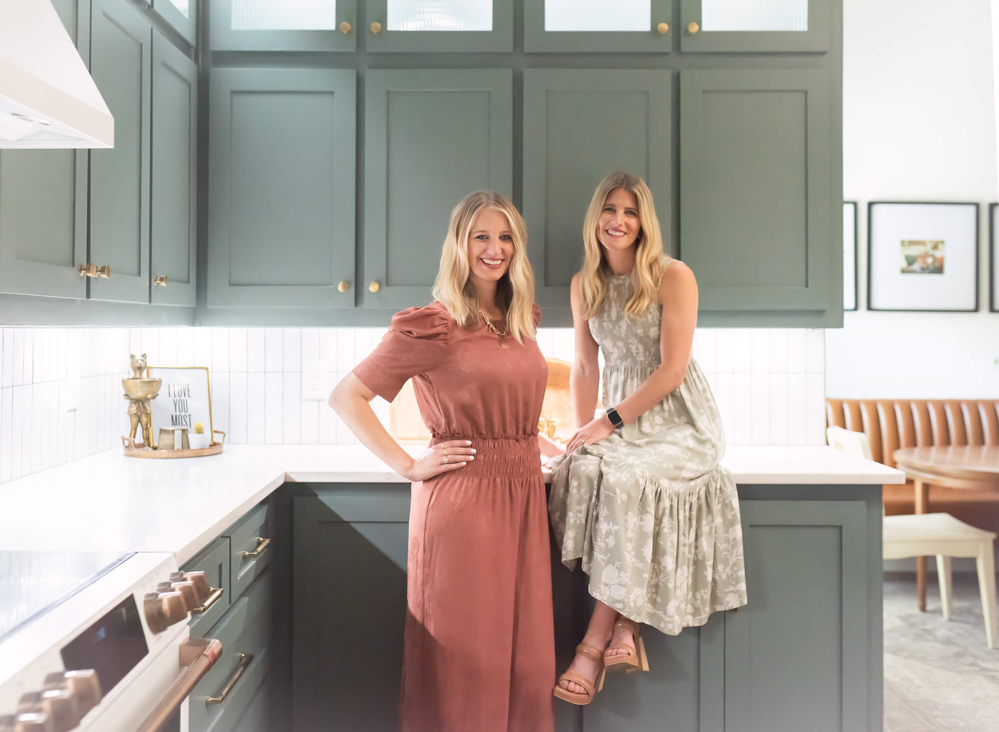 sister business owners posing in kitchen for branding photo session captured by Allison Amores Photography