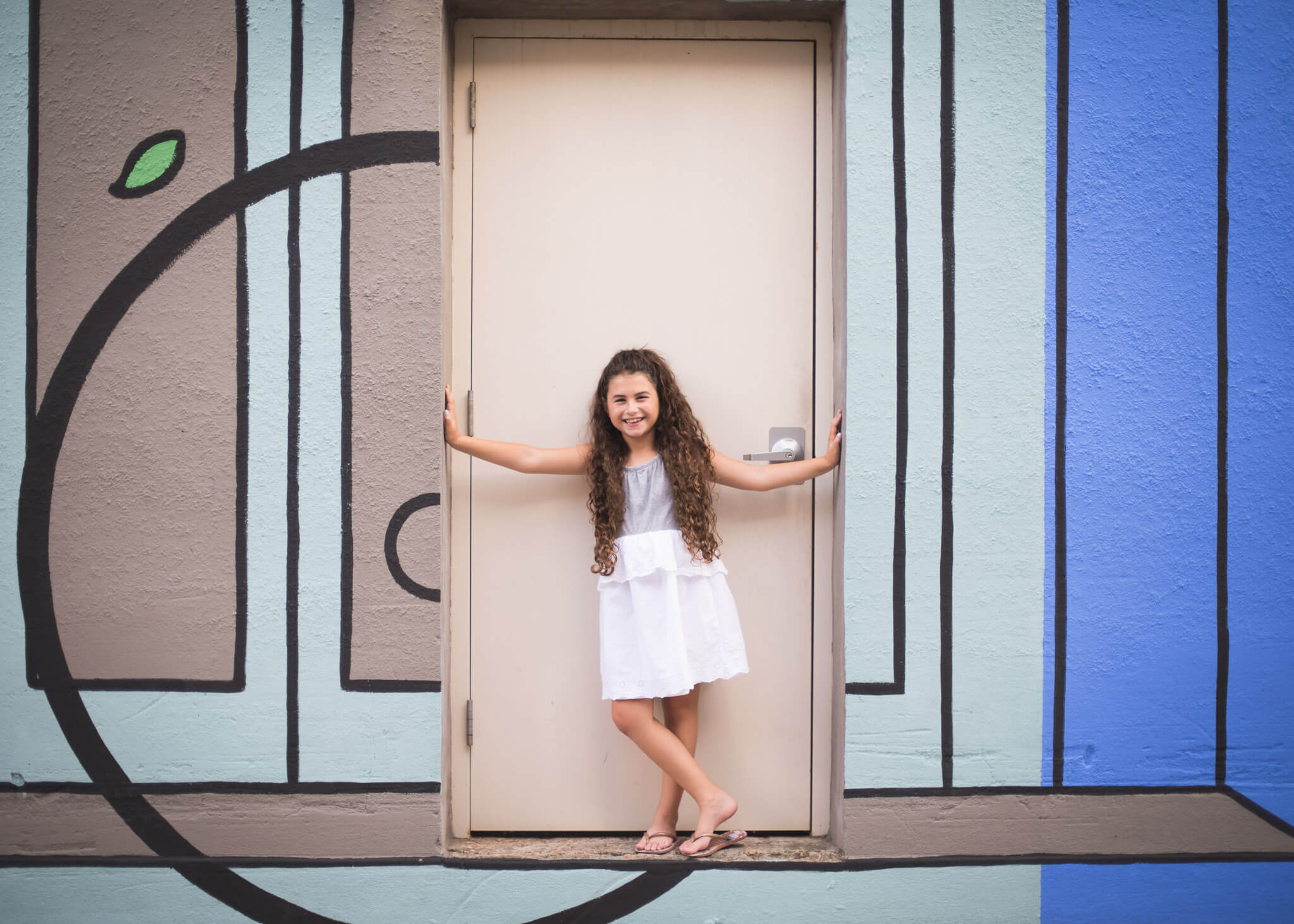 mural backdrop for Children's photo session in downtown McKinney
