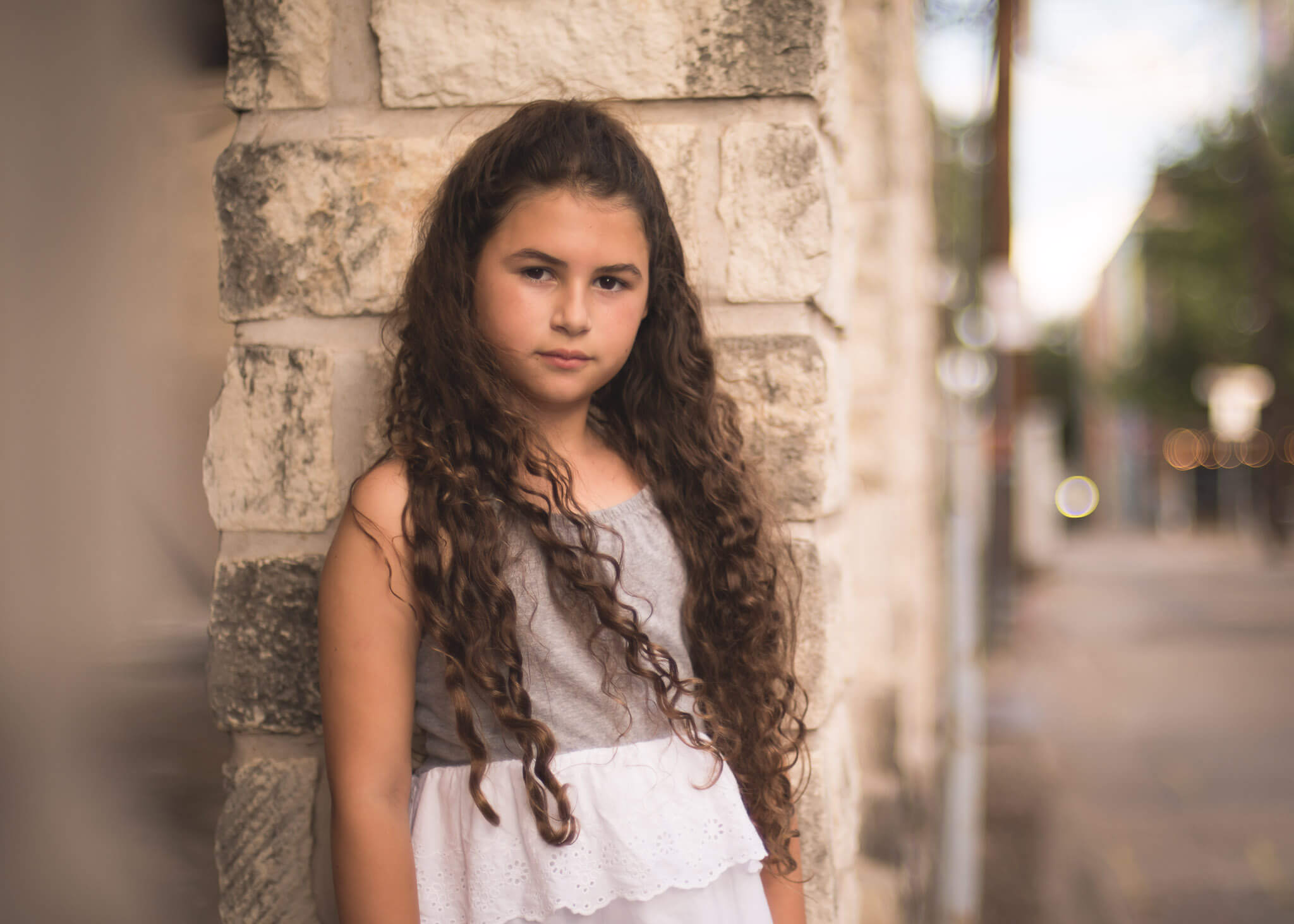 children's portrait of 10 year old girl in downtown mckinney for a photo shoot