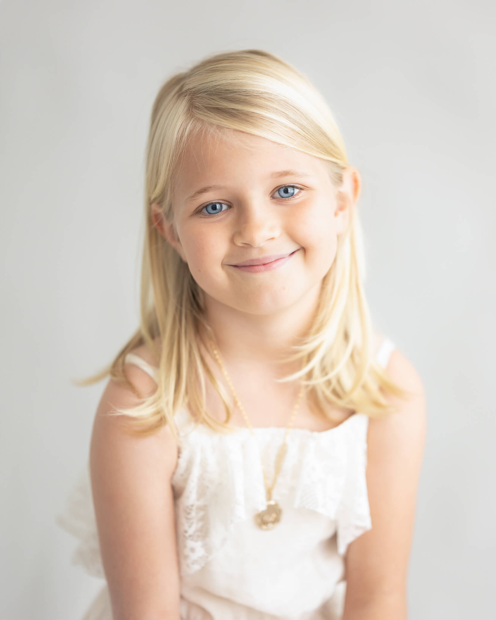 Young girl studio portrait all light colors light and airy