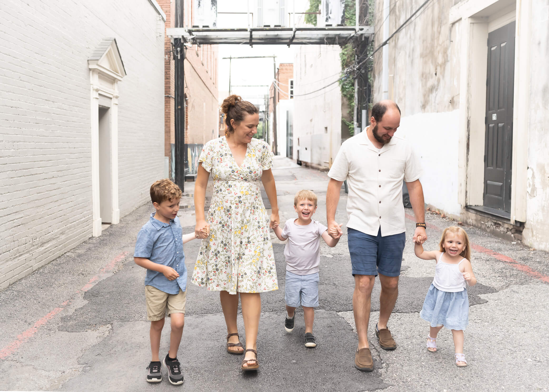 Family walking in an alley in downtown McKinney Texas