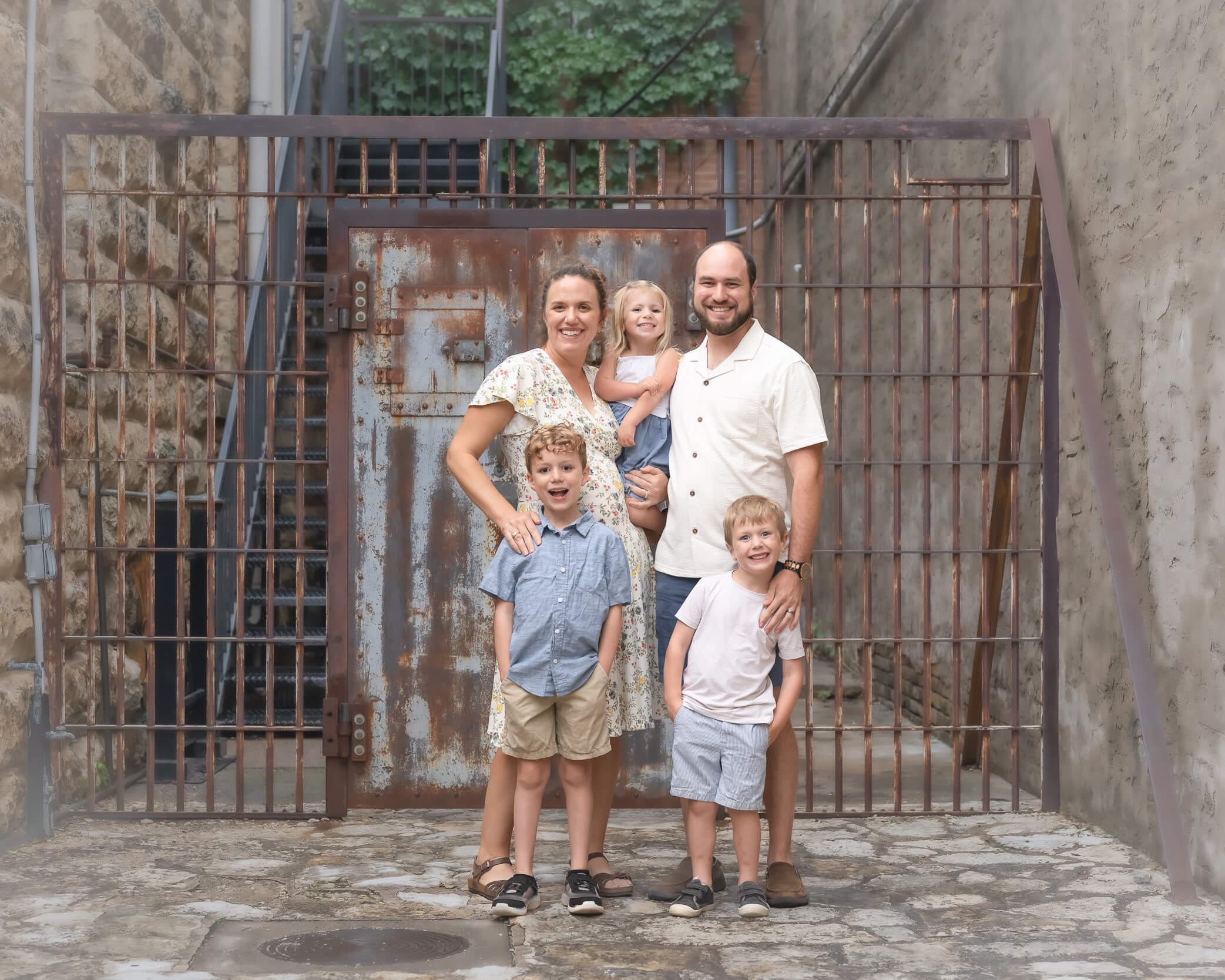 family of 5 in front of old prison in Downtown McKinney