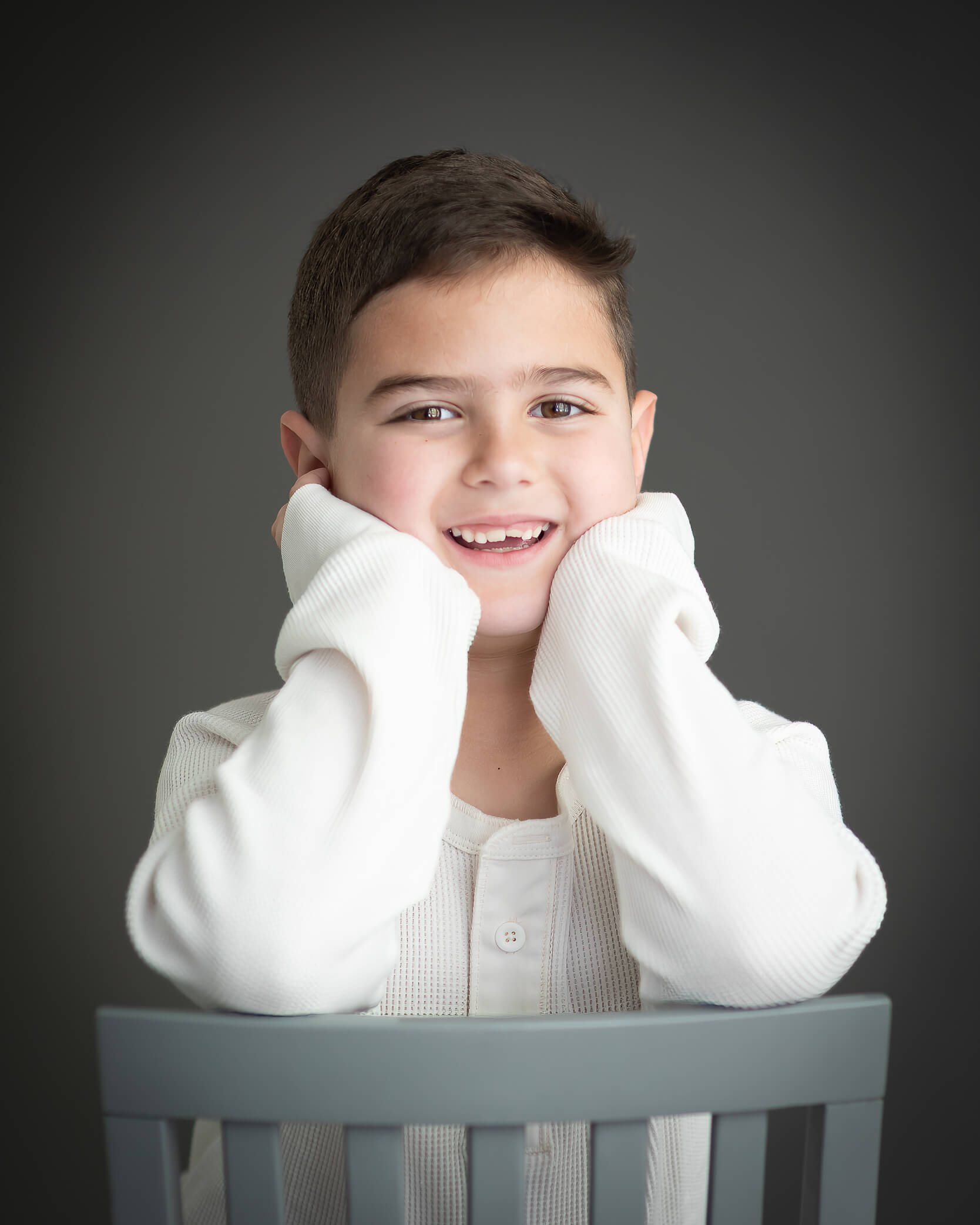 Adorable boy in studio children's portrait captured by Allison Amores Photography