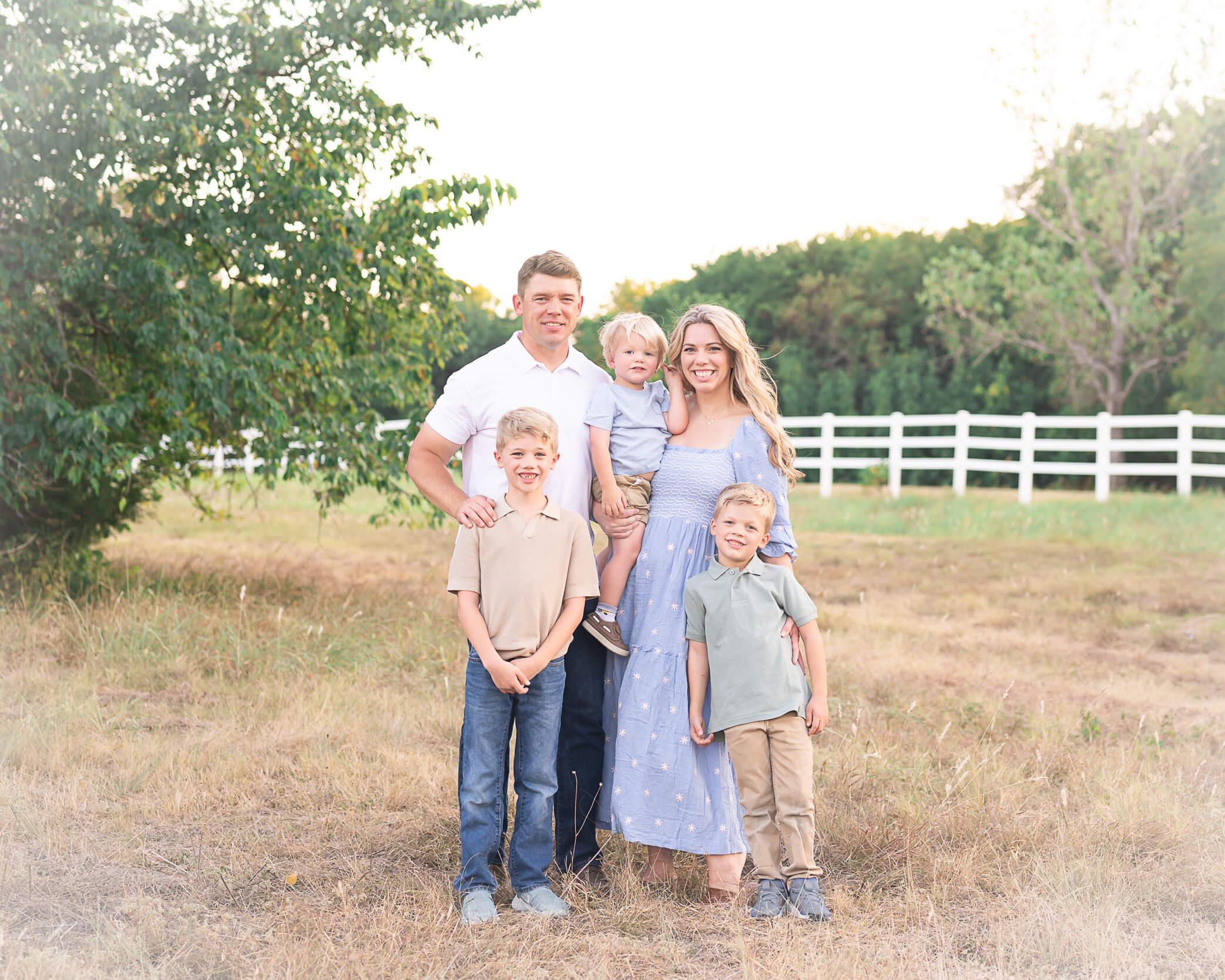 Beautiful family in cool light neutrals in a posed family photo captured by Allison Amores Photography