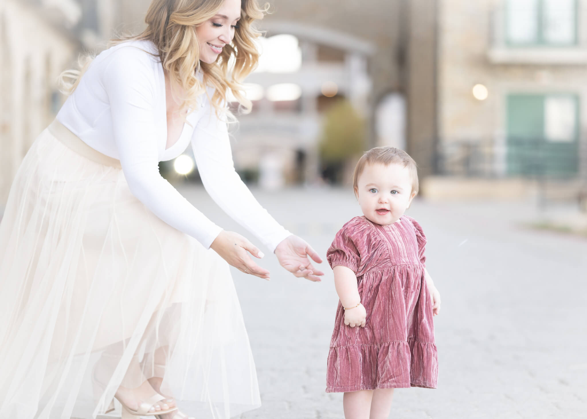 mom with one year old baby in Adriatica village in McKinney Texas