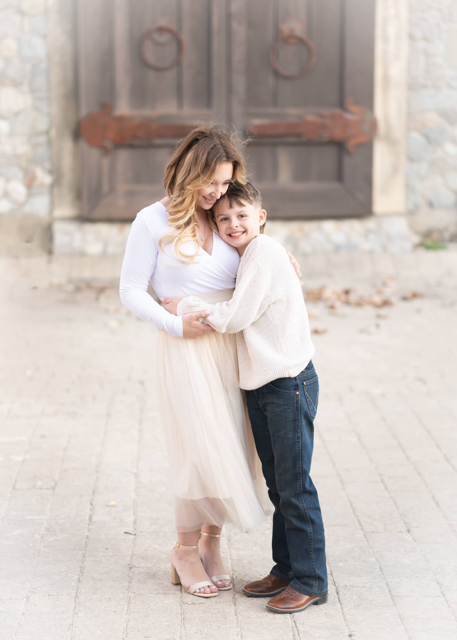 Mom and son in stunning family portrait in Adriatica Village in McKinney Texas. Captured by Allison Amores Photography